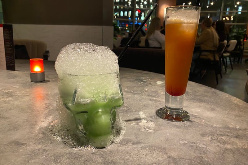 The Green Goblin (left) - rum, melon liquer, apple and blue curaçao - is the most expensive cocktail on the menu at £15