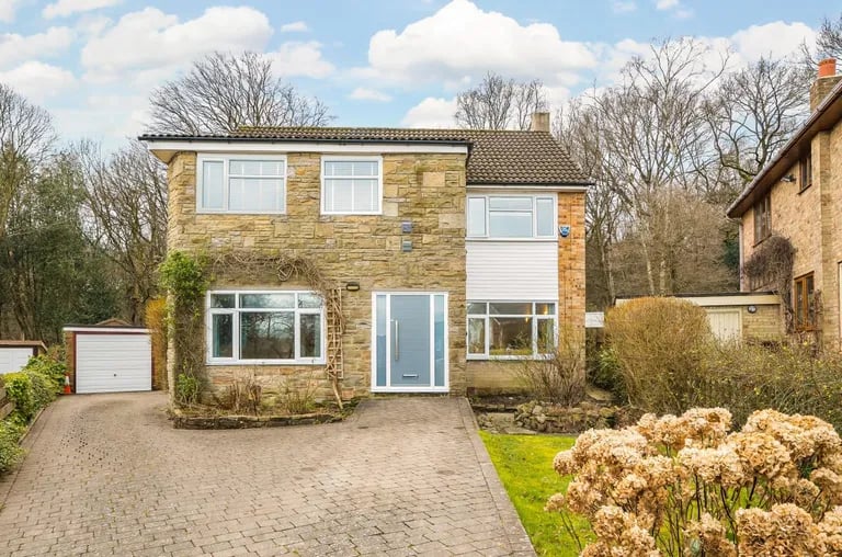 An extended family home on a large corner plot in Horsforth is up for sale.