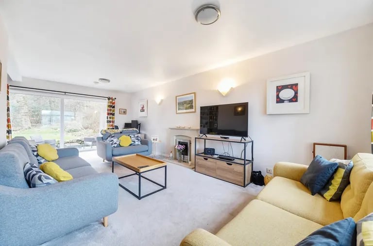 The large reception room sits to the right of the property.