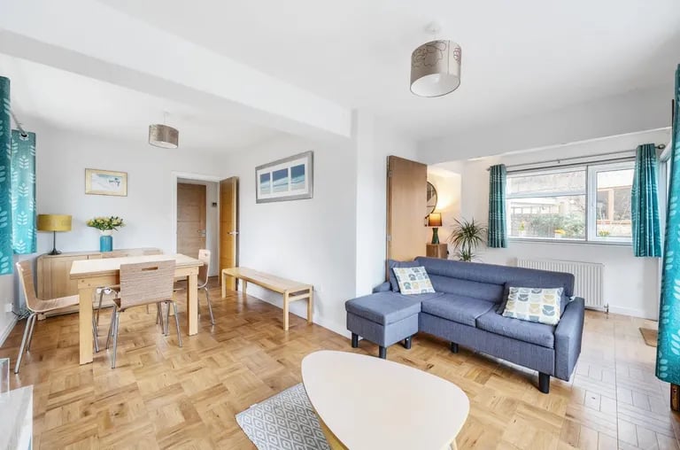 The L-shaped dining room has room for a large dining table and enough space for a snug area and home study.