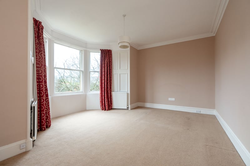 The bright and spacious principal bedroom which features a bay window and enjoys a sunny south facing aspect.