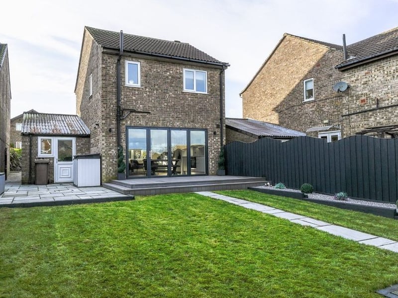 The enclosed space also features patio seating area, gravelled borders, outdoor tap and power outlet.