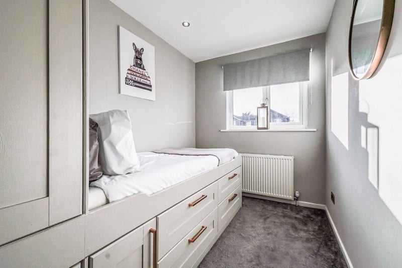 The third room is a good-size single with fitted wardrobes and under-bed storage.