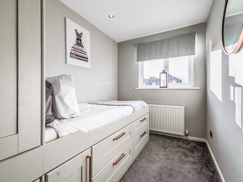 The third room is a good-size single with fitted wardrobes and under-bed storage.