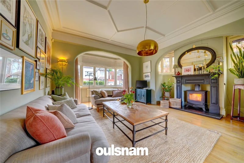 The elegant sitting room has a deep walk-in bay window to the front with feature archway over, inglenook style recess with stained glass windows and Chesney multi-fuel cast iron stove