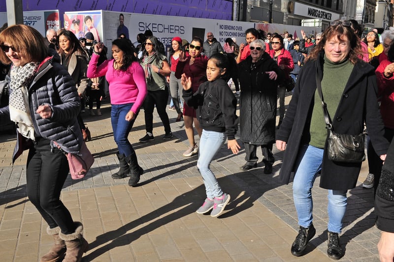 Shoppers were stopped in their tracks as the flash mob unfolded, bringing a burst of energy to the city.