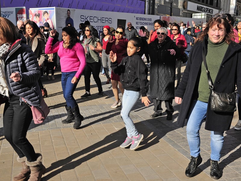 Shoppers were stopped in their tracks as the flash mob unfolded, bringing a burst of energy to the city.