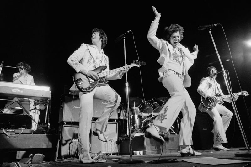 Merrill, Jay and Wayne Osmond performing with American pop group The Osmonds, at the Apollo, Glasgow, on the British leg of their European tour, 25th October 1973.