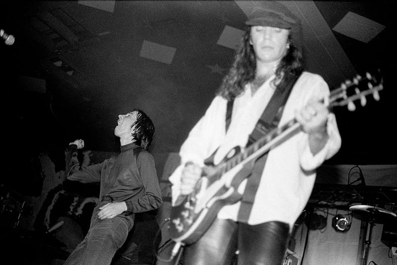 Bobby Gillespie and Robert 'Throb' Young of Primal Scream perform on stage at Barrowlands, October 1991. 