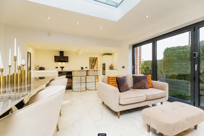 The beautifully extended kitchen/diner/snug room has bifold doors and skylight which brings the outside in creating a lovely family entertaining space. Plenty of gold, too.
