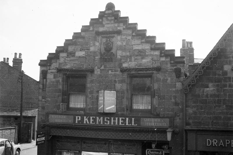The building known as the Bee Hive, on the south side of Rothwell's Commercial Street, at the junction with Holme Street. At this time the building was occupied by Percy Kemshall, newsagent, and just visible on the right is the drapers shop of James Batty & Sons. The building has a date of 1872 on the front gable.