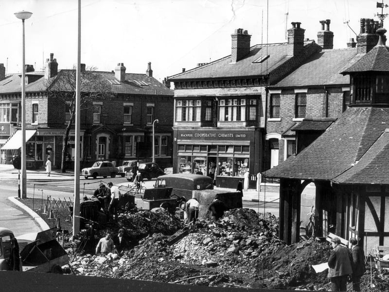 Workmen demolish a Blackpool landmark at Devonshire Square in 1965. The old tram shelter was re-built after inland tram routes were scrapped.