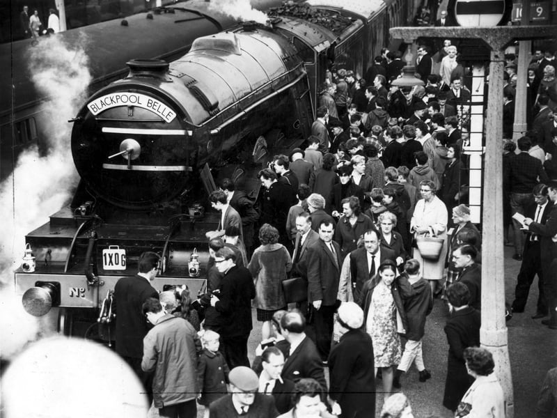 Crowds admire the famous Flying Scotsman railway engine as it arrives at Blackpool North station 8th October 1966. It was decorated with the special nameplate - Blackpool Belle