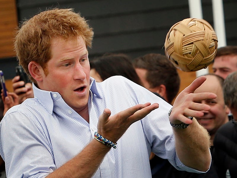 Prince Harry plays a game during a visit to the Commonwealth Games Village on July 29, 2014 in Glasgow, Scotland.