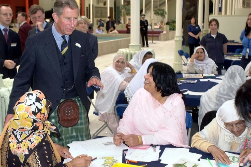 The (then) Prince of Wales in his role as The Duke of Rothesay,  visits the Paradise Garden Carpet project created by women from Glasgow's Muslim Elderly Day Care Centre, at the Royal Museum of Scotland in Edinburgh 05 July 2002. 