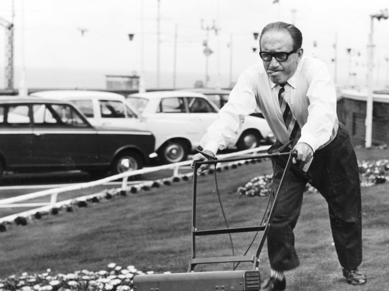 Arthur Askey gets down to some hard graft outside his Blackpool seafront hotel in 1966