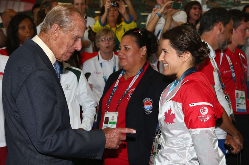 Prince Phillip is greeted by Canadian athlete Isabelle Despras  during a visit to the Athletes Village during the Commonwealth games.