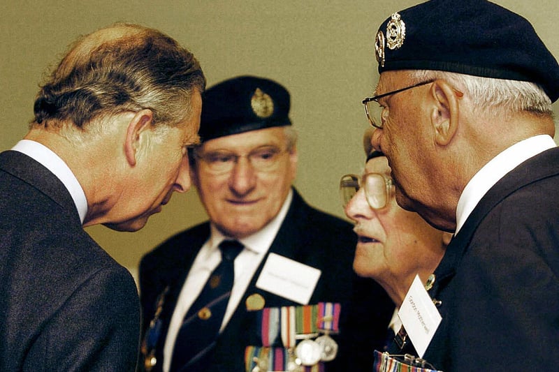 The Prince of Wales meets D-Day veterans at the Albert Halls in Stirling, June 3 2004. The Prince talked to three WWII veterans from Glasgow who recounted their memories of the Normandy landings and the battle in which many of their comrades fell. The meeting at Stirling's Albert Halls - his first visit to the city since the Dunblane massacre of 1996 - came on the last day of a three-day long series of engagements north of the border. 