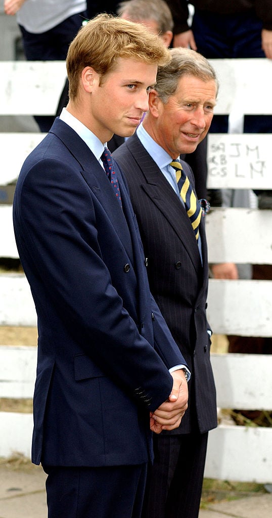 Prince William and Prince Charles stand together September 21, 2001 in Glasgow ahead of William beginning his studies at St. Andrews University the following week