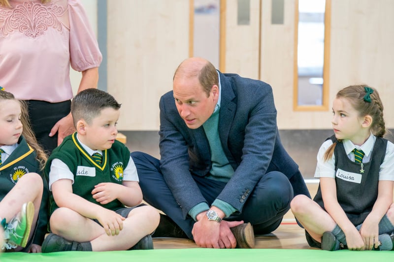 Prince William, Duke of Cambridge meets pupils during a visit to St. John's Primary School, Port Glasgow to partake in a Roots of Empathy session on May 11, 2022 in Glasgow, Scotland. 