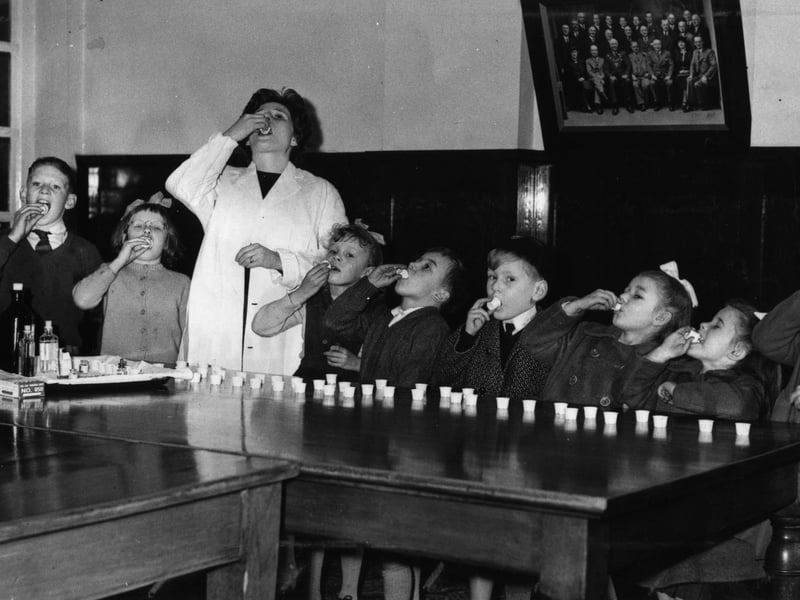 School children taking polio sugar lumps at Blackpool Health Centre on Whitegate Drive, March 1962