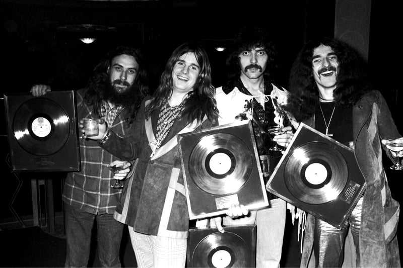 Birmingham's biggest band Black Sabbath pose for a group portrait with gold discs, London, 1973, L-R Bill Ward, Ozzy Osbourne, Tony Iommi, Geezer Butler.