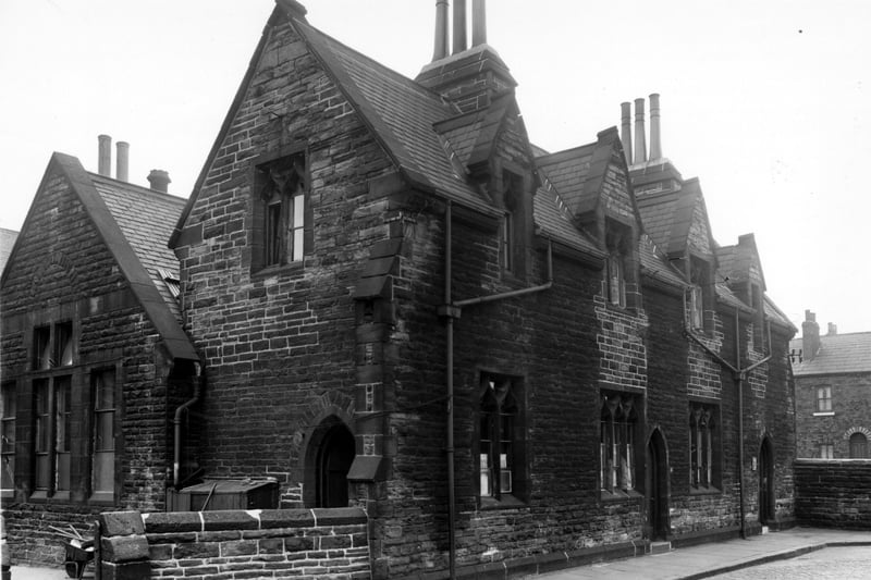 St. John Church of England Infant School on Pear Street in Burmantofts which is believed to have been built in 1859. The Church of St. John The Baptist was on Robson Street with the entrance and vicarage on Granville Terrace. The photo was taken around the mid 1950s, prior to major redevelopment of this area.