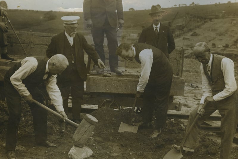 The Mayor of Blackpool and the Town clerk (DL Harbottle) on the right, find that shovelling the first load of soil for the new dam is not a cool task, so they have taken off their coats.
The Mayor of Lytham St Annes thinks the wooden mallet more covenient, if not so efficient, as a sledge-hammer. Ald John Bickerstaffe and the Chairman of the Fleetwood Council are amused at this display of energy, 1925