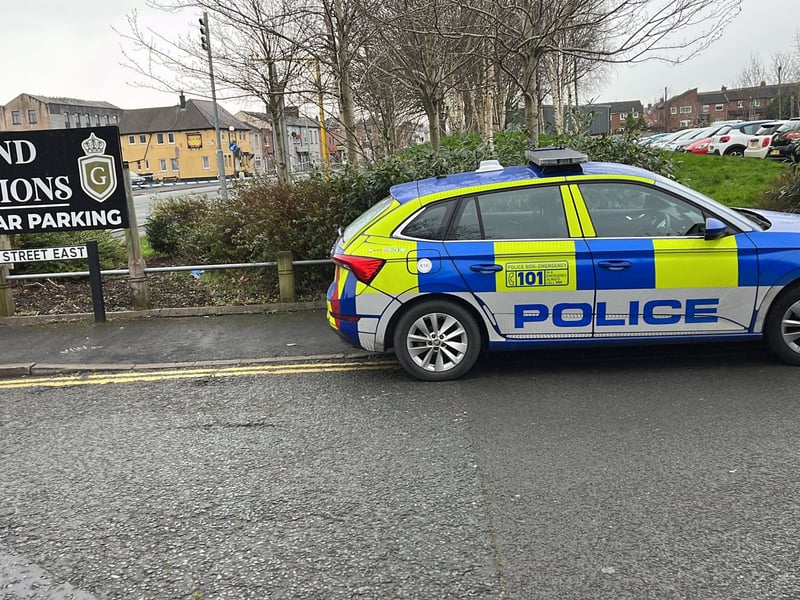 Police at the scene of the shooting in London Road, Preston