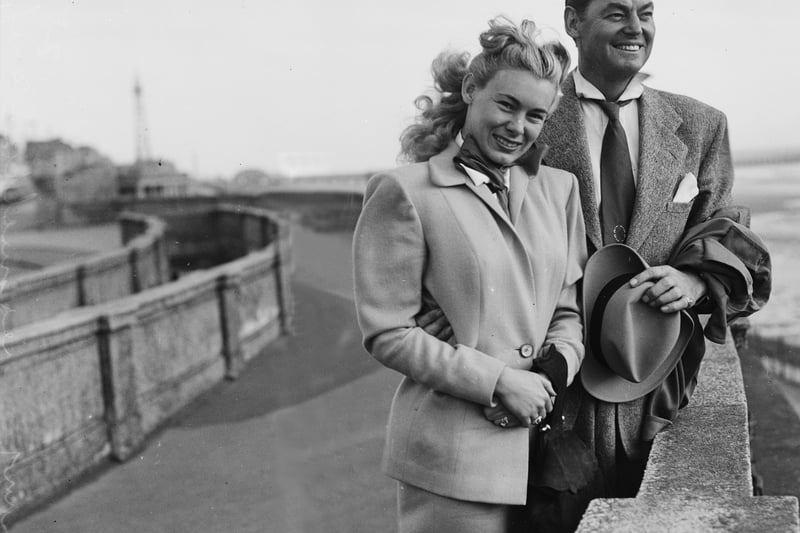 Johnny Weissmuller (famous for his role as Tarzan ) with his wife Allene on Blackpool Promenade in 1949. Former Olympic swimming champion, he was in Blackpool to perform at "The Water Follies" at the Derby Baths
