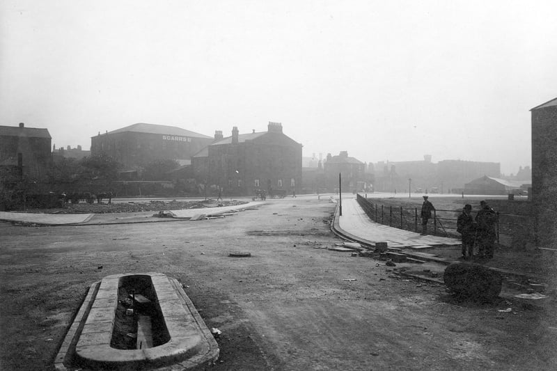 Construction of pavements at bottom of The Headrow in September 1931. In the background can be seen Scarr's Ltd. warehouse.