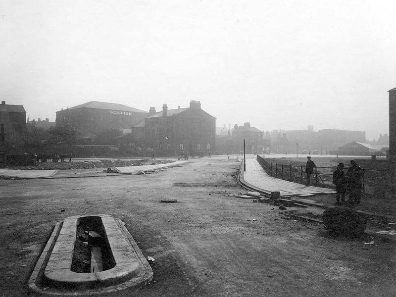 Construction of pavements at bottom of The Headrow in September 1931. In the background can be seen Scarr's Ltd. warehouse.
