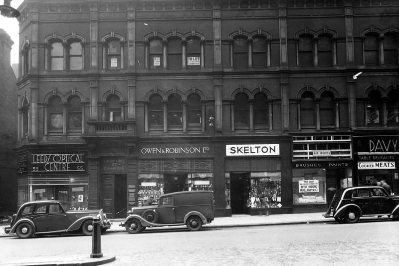 Shops on The Headrow in September 1938. Pictured, from left, are Leeds Optical Centre, Thorntons Chambers, Owen and Robinson Ltd., Skelton, Alf Jenkins, Davy's. 
