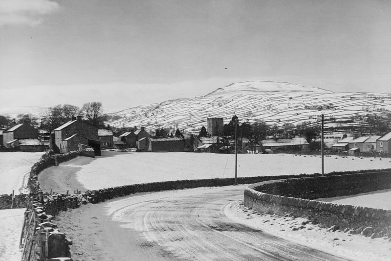 Grinton in Swaledale with Reeth Low Moor beyond. Carver Hill is on skyline. Pictured in February 1950.