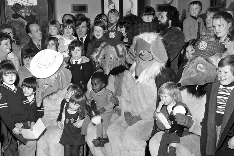 The Wombles help distribute Evening News/Odeon Charity Appeal Christmas presents at Leith hospital in December 1974.