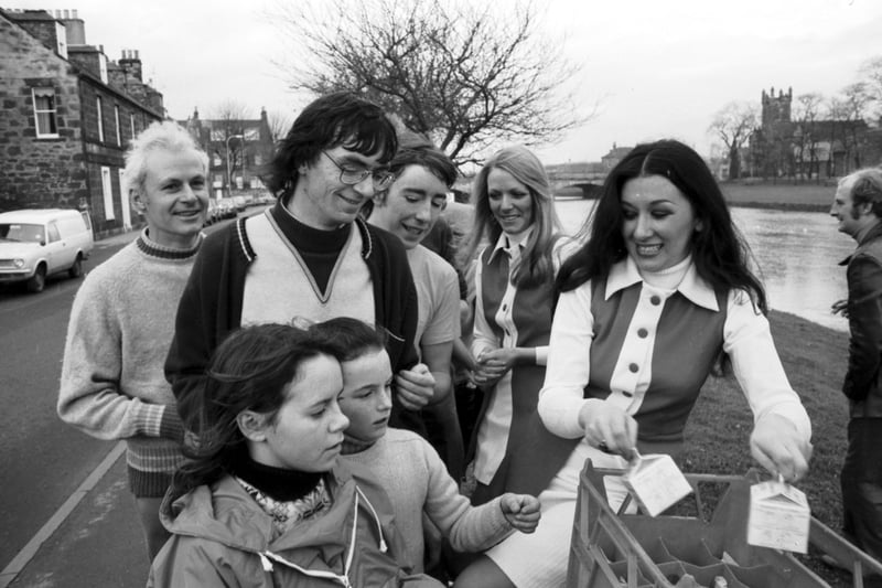 The Pinta Girls hand out cartons of milk to people on the Evening News Charity Walk in December 1974.