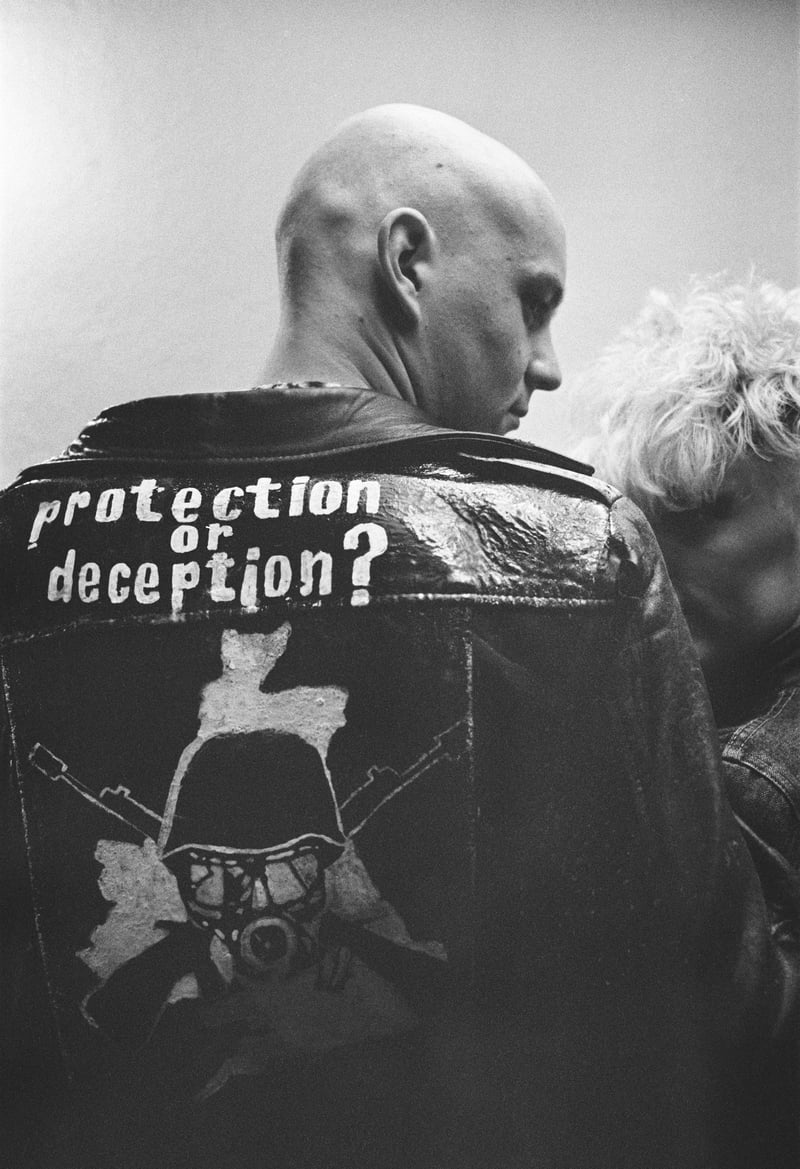 A Glasgow skinhead poses for a picture with his DIY leather jacket at The Damned gig at Tiffany's October 15 1982.