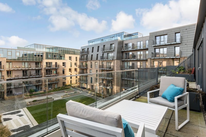 One of the property's two spacious balcony terraces, offering ideal outdoor spaces for dining furniture – perfect for enjoying an alfresco meal during the warmer months.