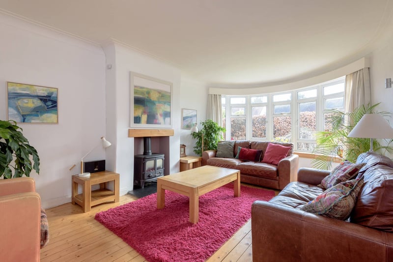 The East Lothian property's sitting room comes with a bay window and gas woodburner.