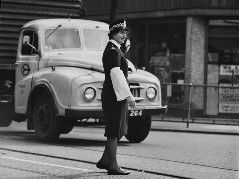 A female police officer on traffic duty in Govan Road.