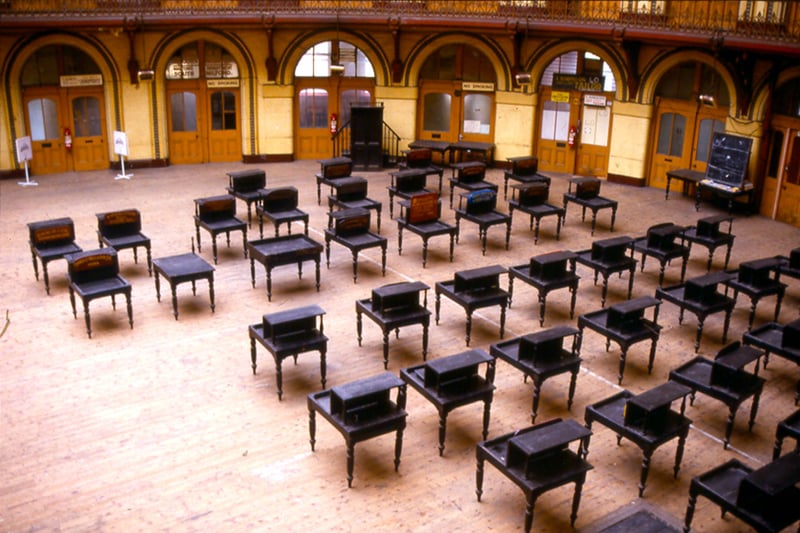 Trader's desks arranged across the ground floor of the Corn Exchange. The Corn Exchange was redeveloped in 1990 to provide speciality shops and a basement cafe. The building, elliptical in shape, was originally designed by Cuthbert Brodrick and opened on  July 28, 1863.