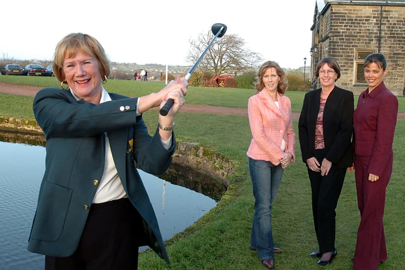 Golfers at Cookridge Hall Golf Club had  raised more than£6,000 for two charities-Candlelighters and Ataxia Uk. Pictured in Decembr 2004 is lady's captain Carol Rushfirth teeing off, watched by the recipients who received the cheques at the golf club's AGM.They are, from left Joanne Llewellyn from  Candlelighters, Jan Owen from Ataxia UK and Samantha Ball from Candlelighters.