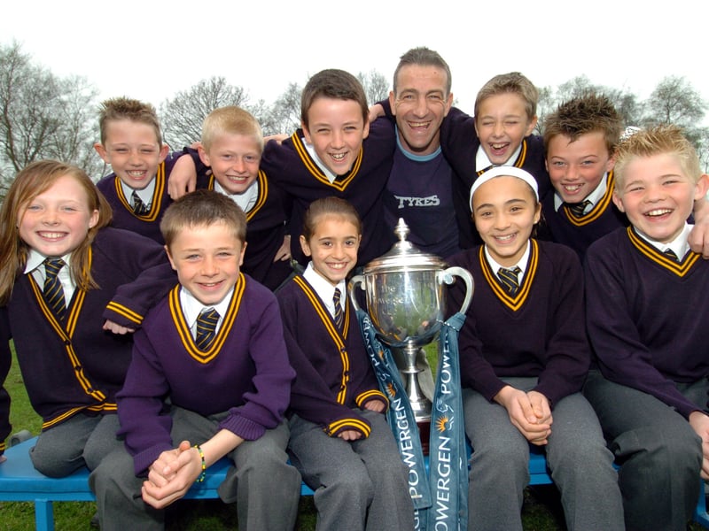 Leeds Tykes star John Bentley was at Holy Trinity School in April 2005 to show off the Powergen Cup to the pupils. He is pictured with members of the team who played for the school at Twickenham.