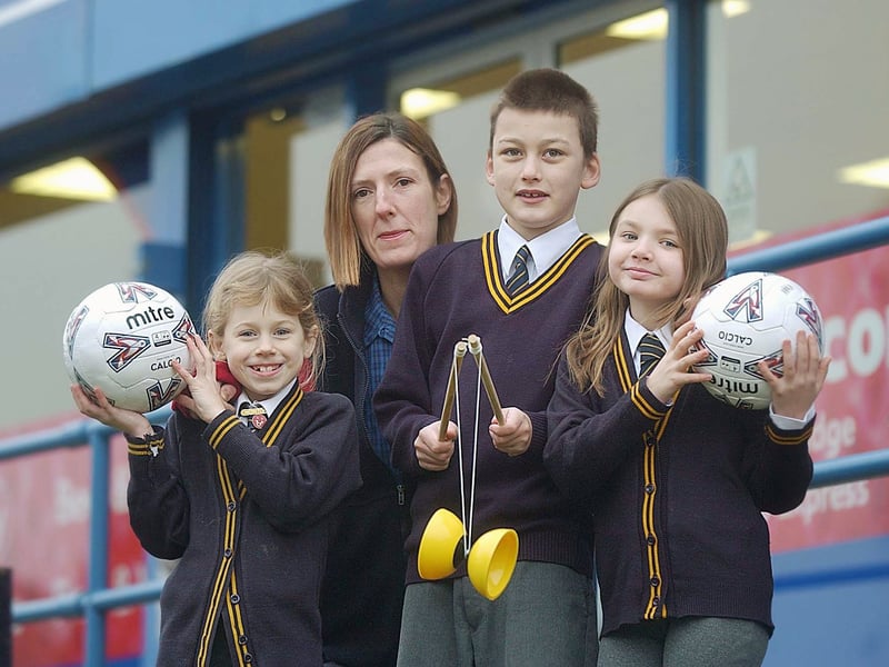 Holy Trinity Primary School pupils in February 2006 with equipment received through Tesco's sports vouchers for schools scheme. Pictured, from left, are Phoebe Lister, Lisa McManus of Tesco, Murphy Boreham and Alex Atkinson.