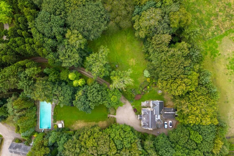 Exterior: Outbuildings include a two-storey barn conversion, former stable in use as a gym, and the home’s
wrap-around garden is lined with trees, adding privacy.
Contact Online Property Auctions Scotland