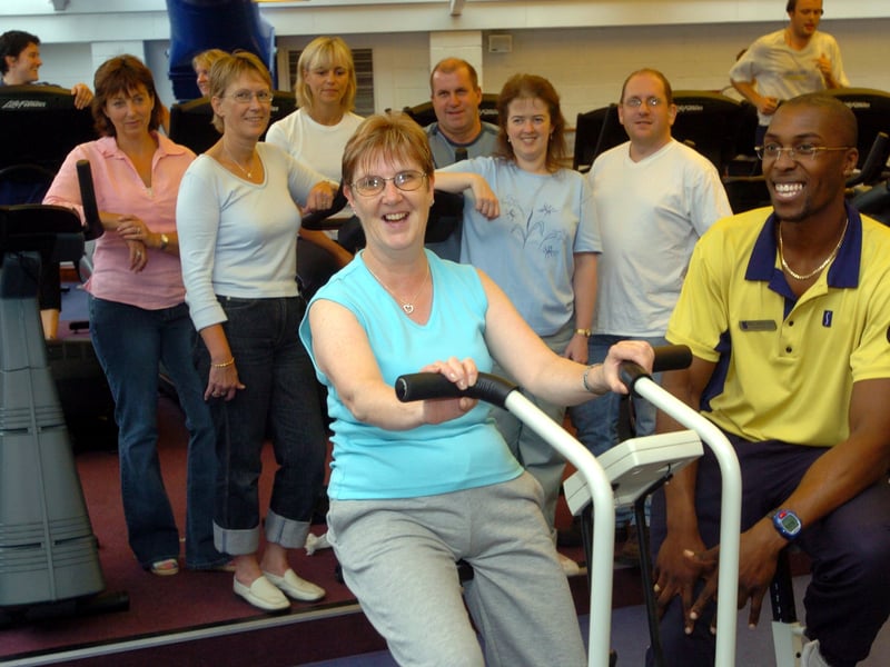 Fitness instuctor, Mike Hendicks, of Esporta gym in Cookridge puts Anita Butcher through some exercises watched by her colleagues from Cookridge Hospital who were preparing for charity trek to China. Pictured in August 2004.