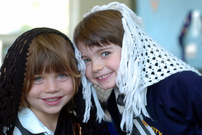 Pupils Josie Lee, left, and Eleanor Start dress up as part of Multicultural Week at Holy Trinity C of E Primary in October 2004.