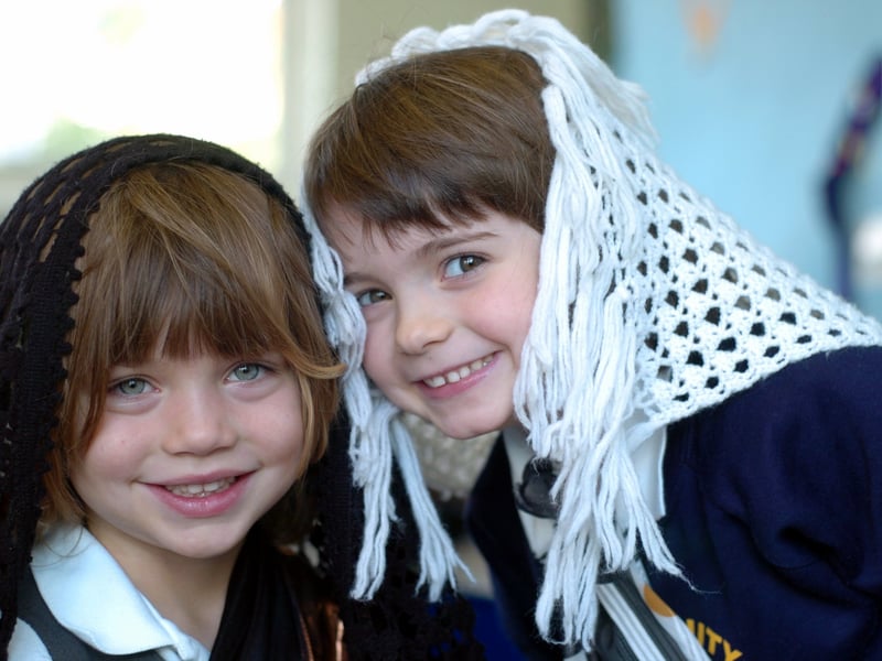 Pupils Josie Lee, left, and Eleanor Start dress up as part of Multicultural Week at Holy Trinity C of E Primary in October 2004.