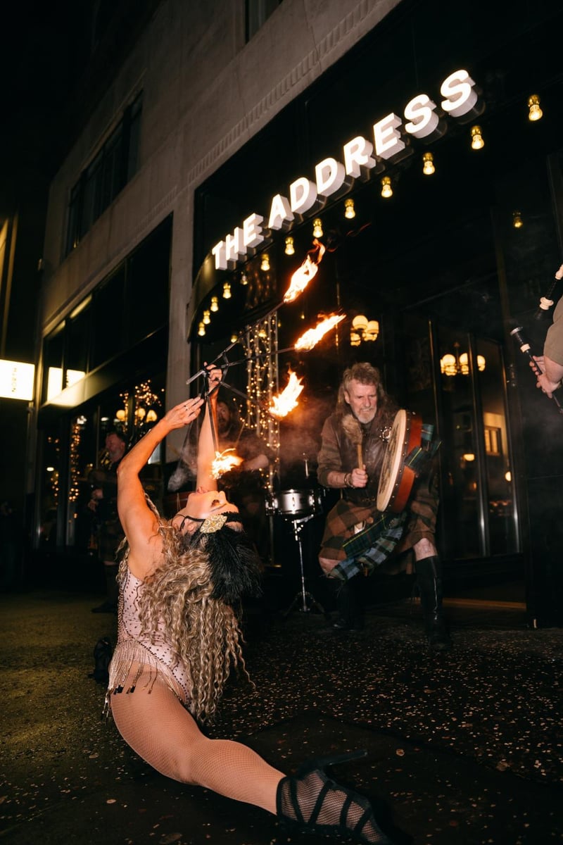 A fire-eater does what she does best as Clan Ann Drumma play in the background