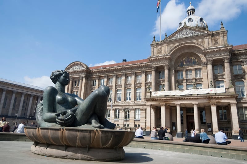 A woman statue fountain in Victoria Square. Brummies giggle at its nickname "The Floozie in the Jacuzzi" and wonder if the lady in bronze ever gets chilly.